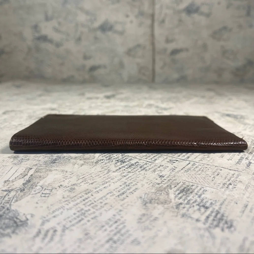 Smythson Antique lizard skin passport wallet with gold corners